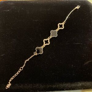 NWOT Blossom Black Clover Bracelet.